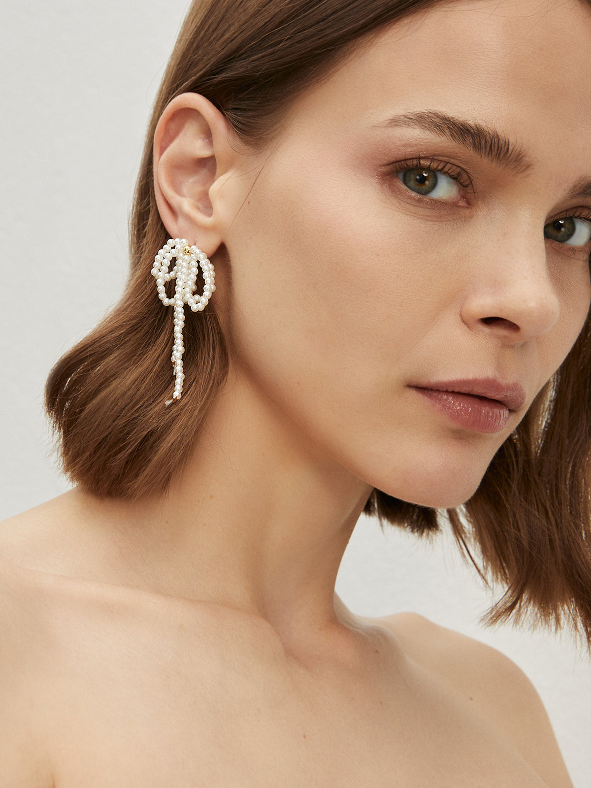 Ohrringe mit Schleife, Perle und Quaste