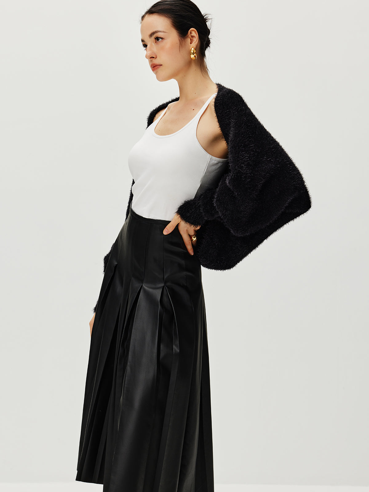 Haussement d'épaules Caïdigan duveteux