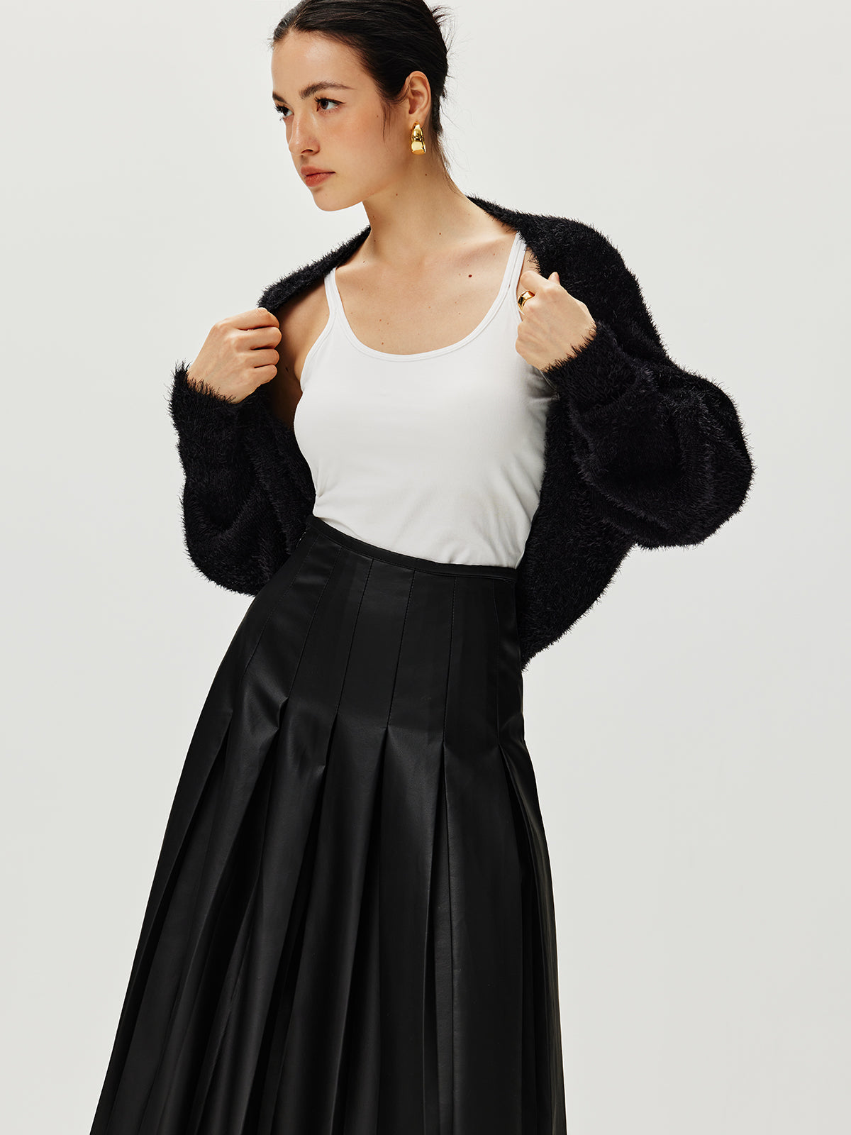 Haussement d'épaules Caïdigan duveteux