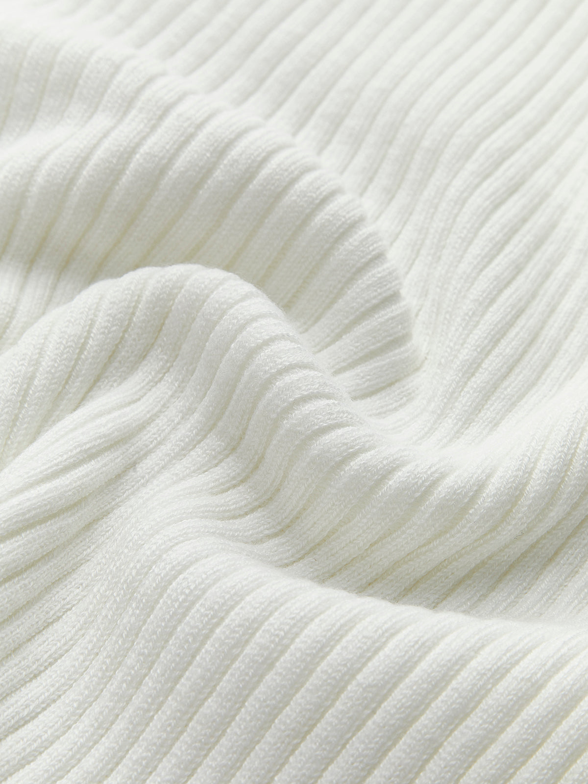 Haut asymétrique à col rond côtelé en maille