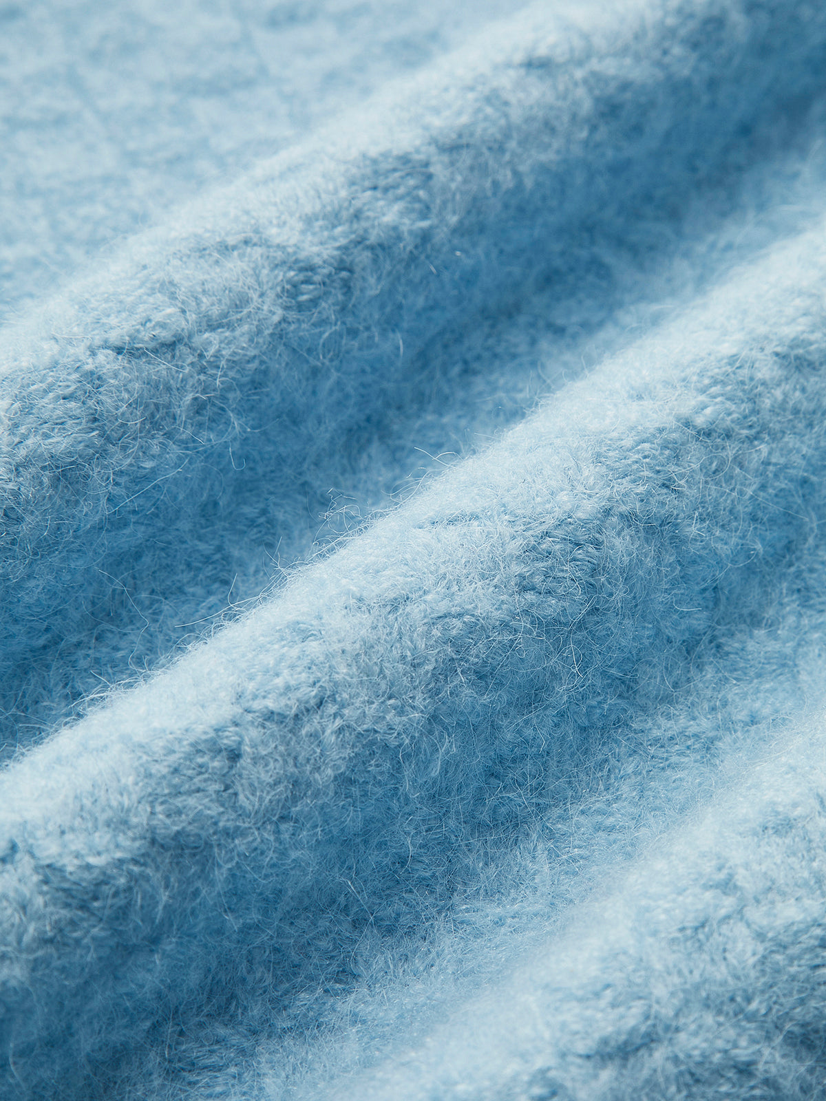 Gilet sans manches à bretelles croisées orné de perles