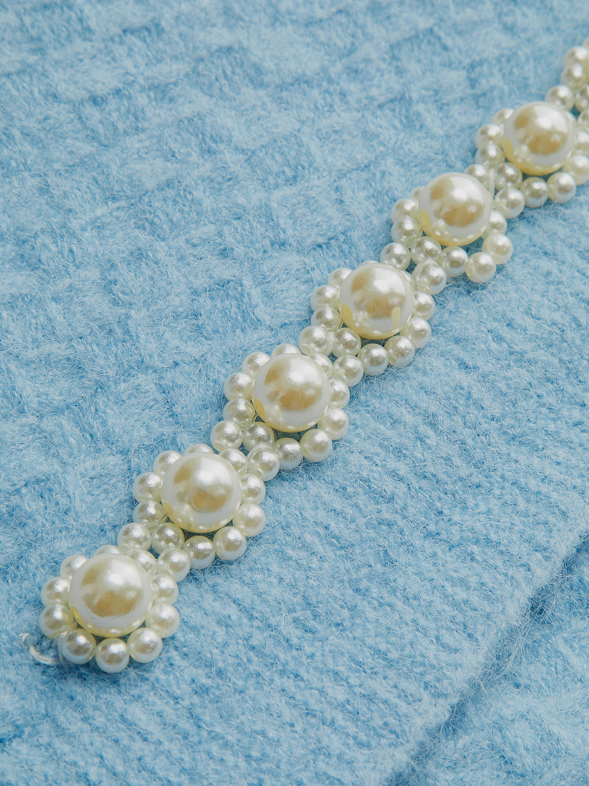 Gilet sans manches à bretelles croisées orné de perles