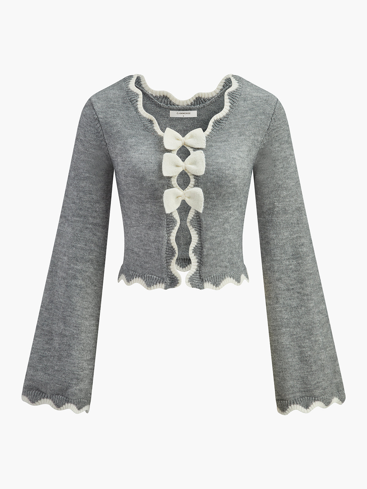 Pull à nœud et bordure ondulée contrastée