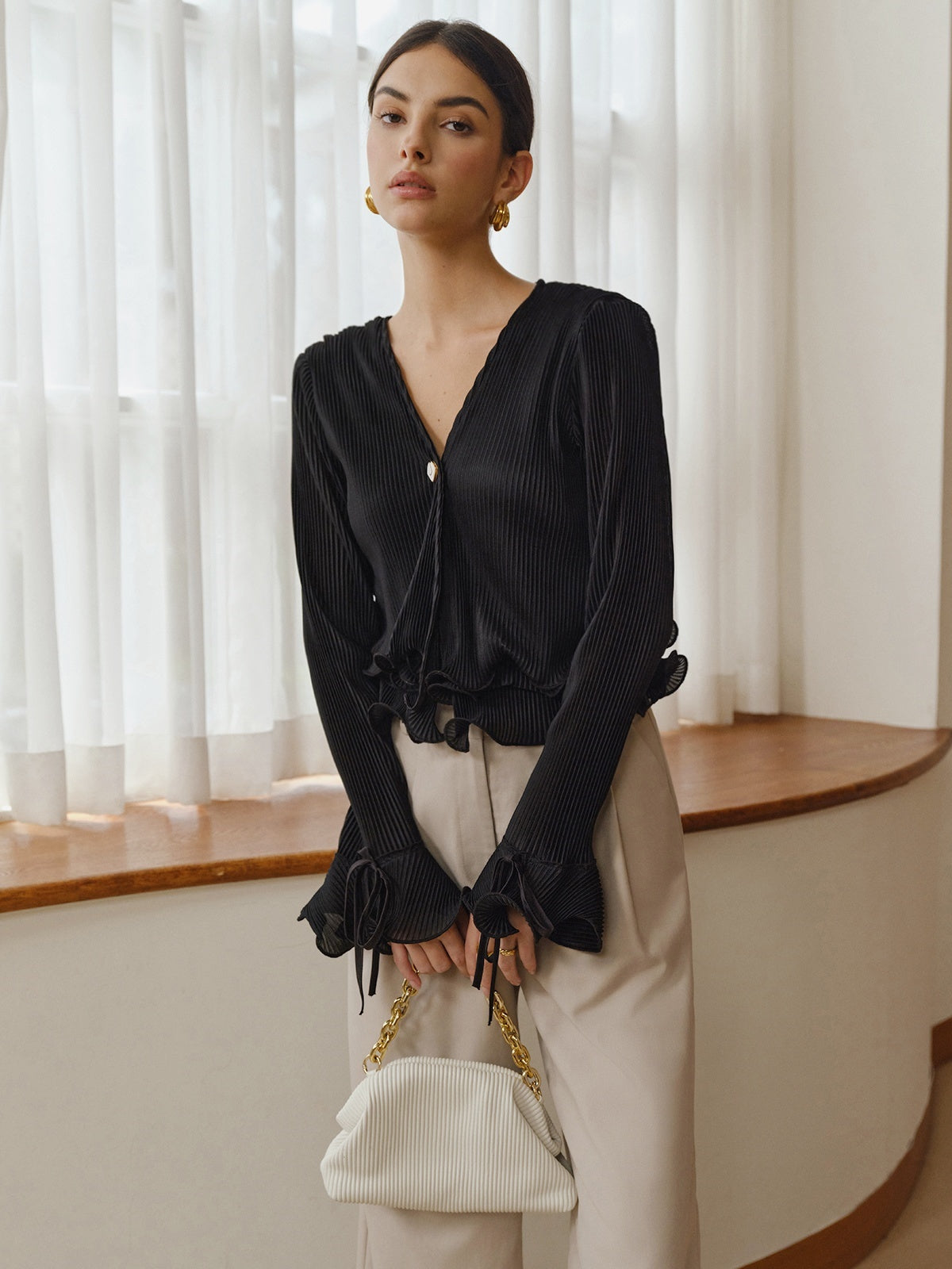 Chemisier plissé à boutons volantés