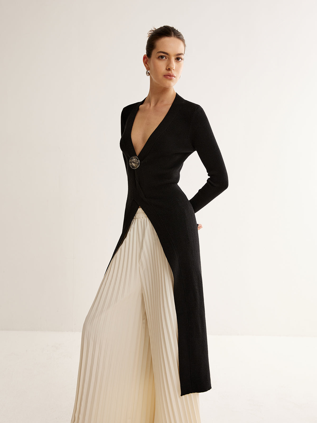 Haut long en maille fendue avec décor métallique