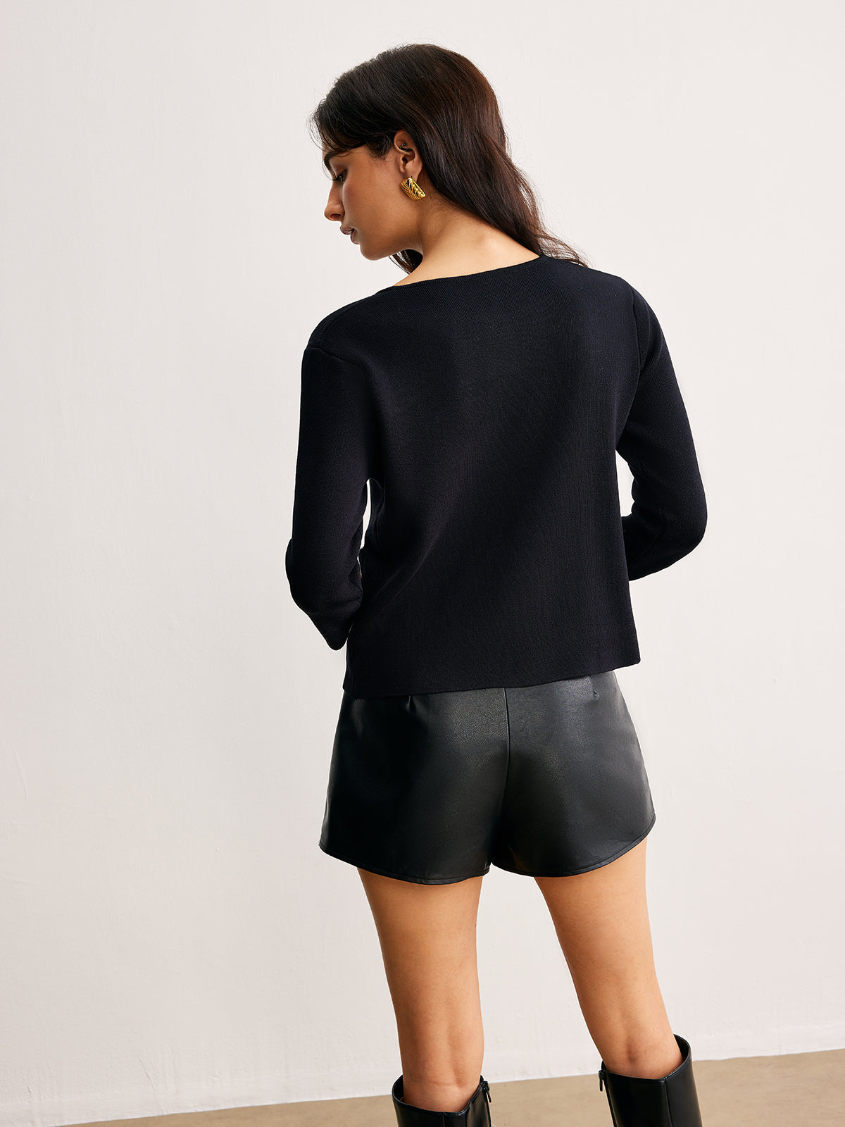 Strickoberteil mit Schleifenverzierung und Taschen