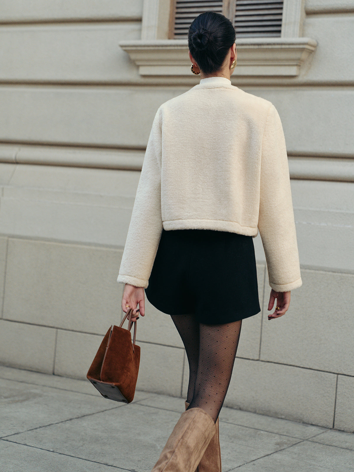 Manteau court élégant en fausse fourrure