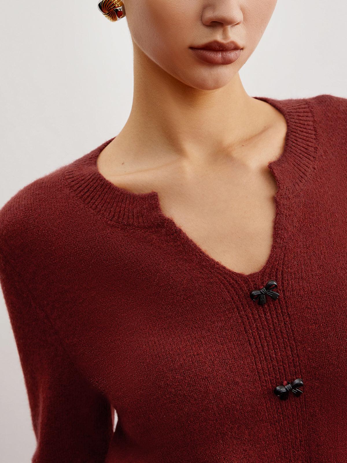 Pullover mit Schleifendetail und Schlitz