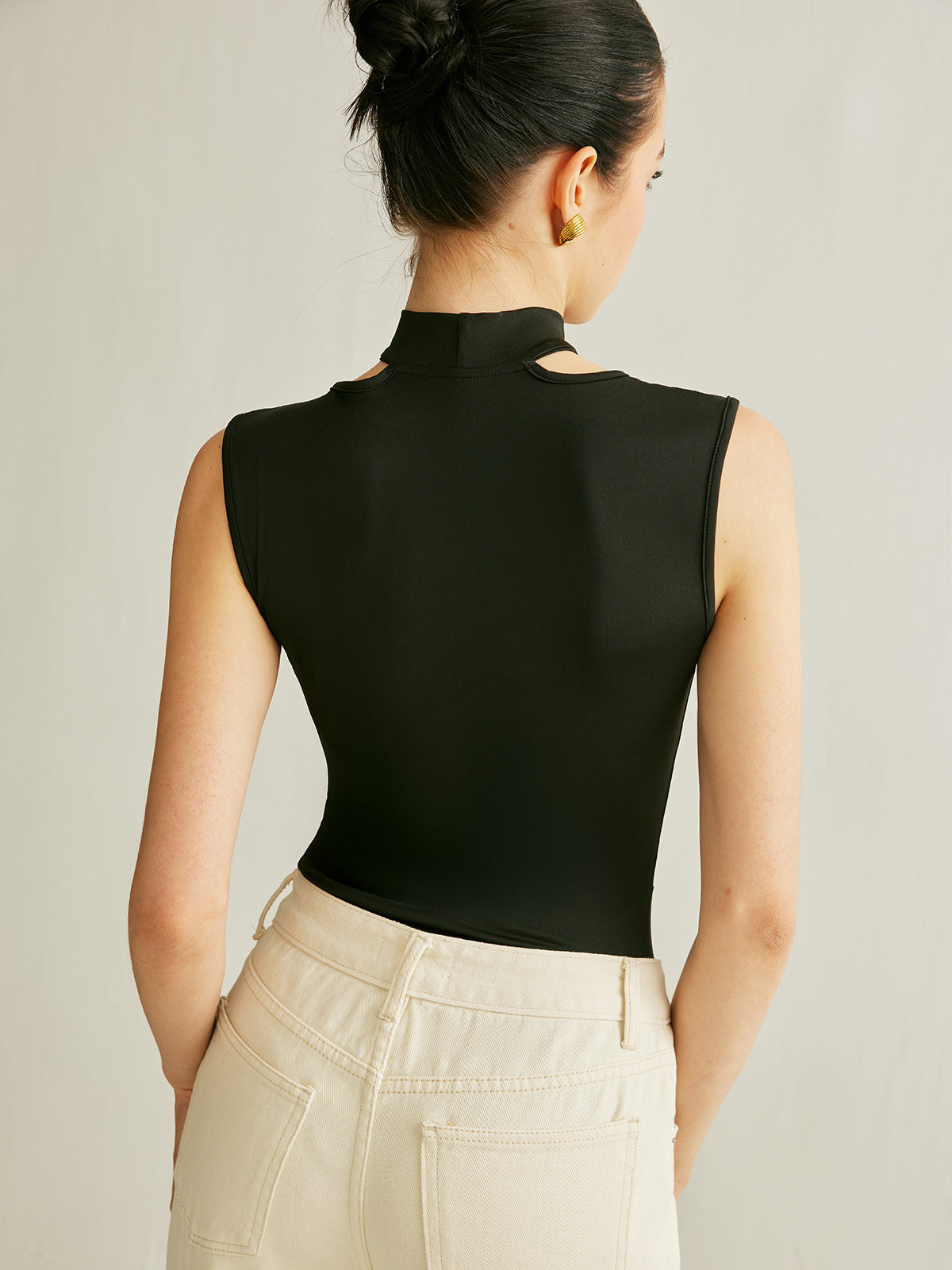 Body athleisure sans manches à découpes