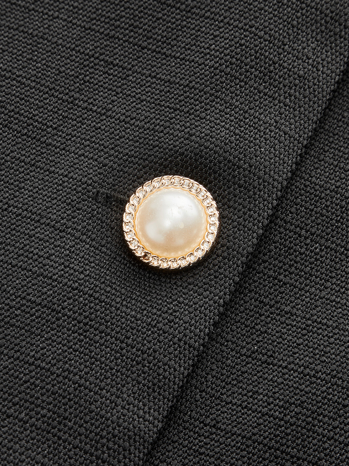 Combinaison dos nu boutonnée sur le devant