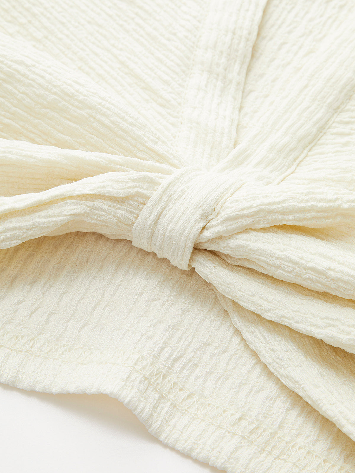 Haut sans manches à col en V et nœud sur le devant