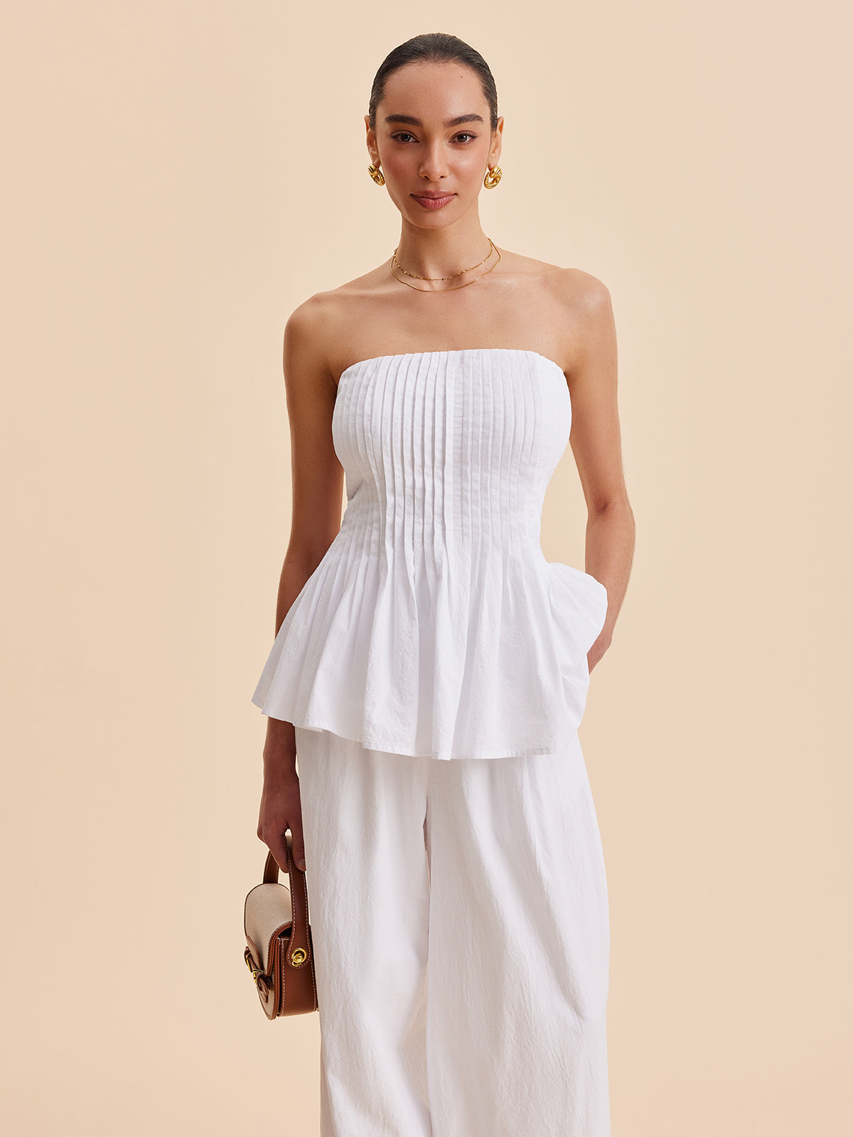 Gefaltetes trägerloses Peplum-Top aus Baumwolle