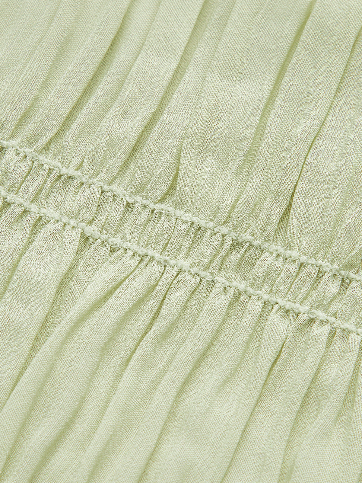 Robe plissée à bretelles semi-transparentes