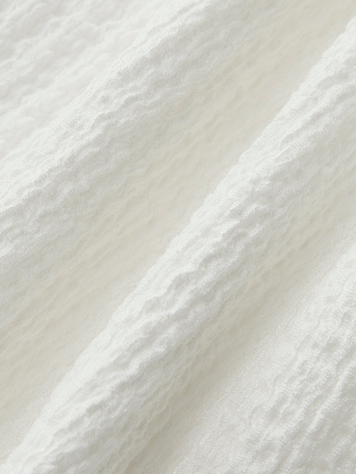 Haut à col en V et taille froncée orné d'un nœud