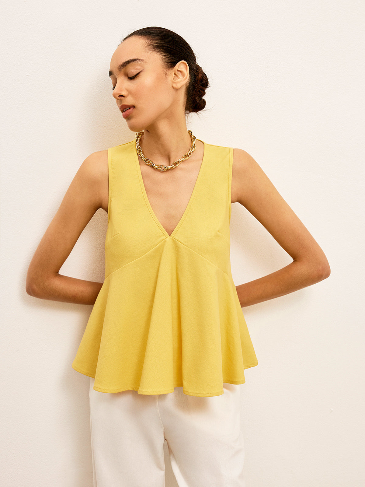 Haut péplum à col en V en coton et lin