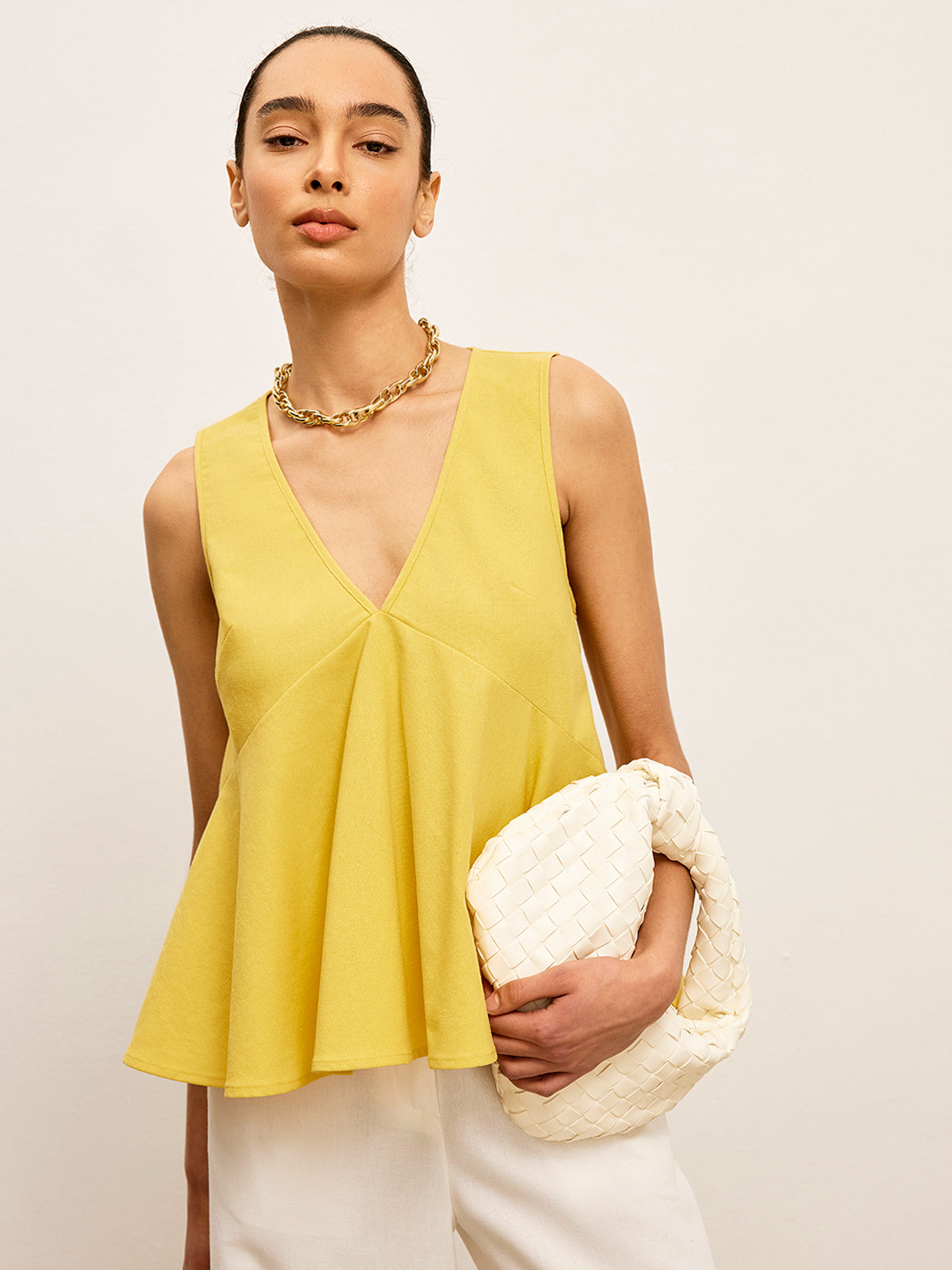 Haut péplum à col en V en coton et lin