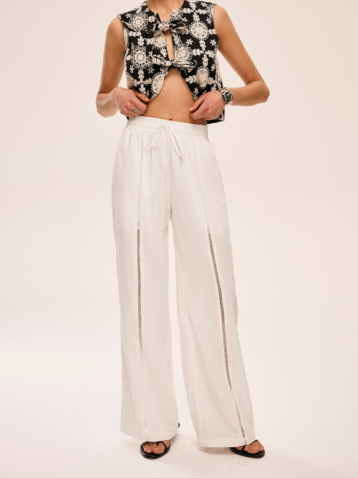 Pantalon semi-transparent taille haute avec poches