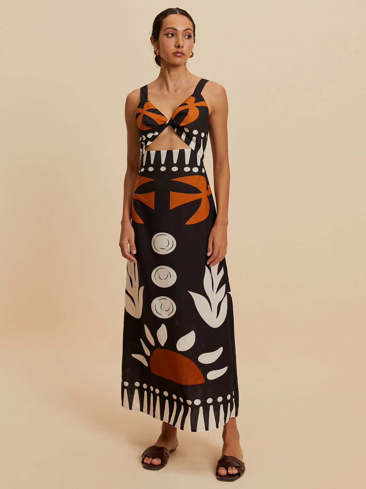 Robe fleurie sans manches à découpe et fermeture éclair