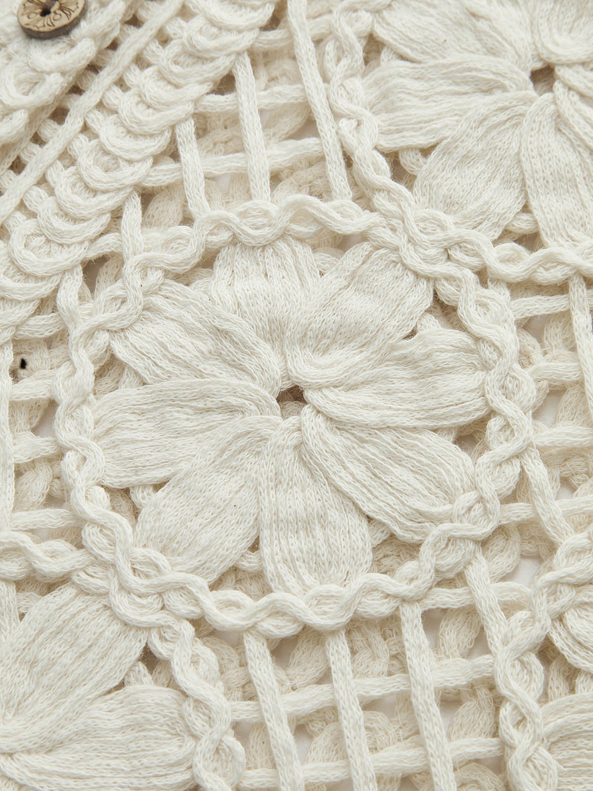 Débardeur en jacquard semi-transparent à découpes et col en V