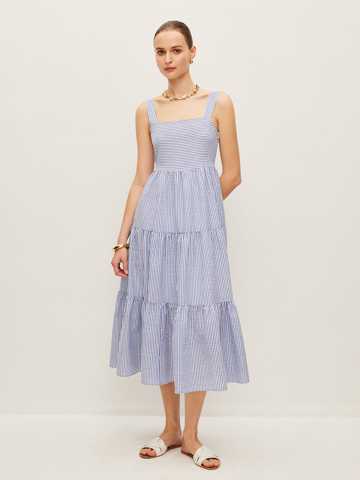 Robe sans manches rayée boutonnée