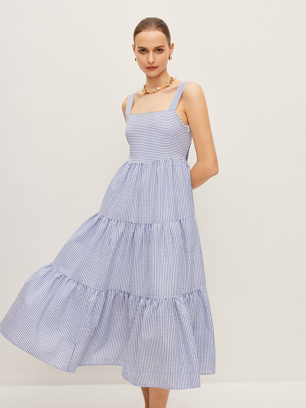 Robe sans manches rayée boutonnée