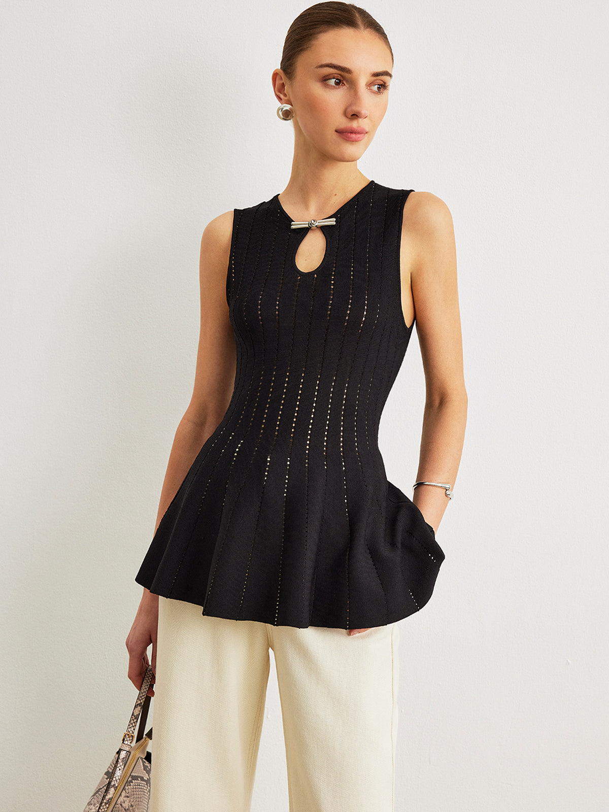 Haut péplum en maille semi-transparente avec nœud