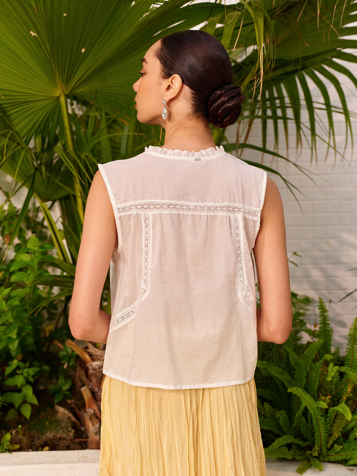 Chemisier semi-transparent en dentelle brodée à nouer