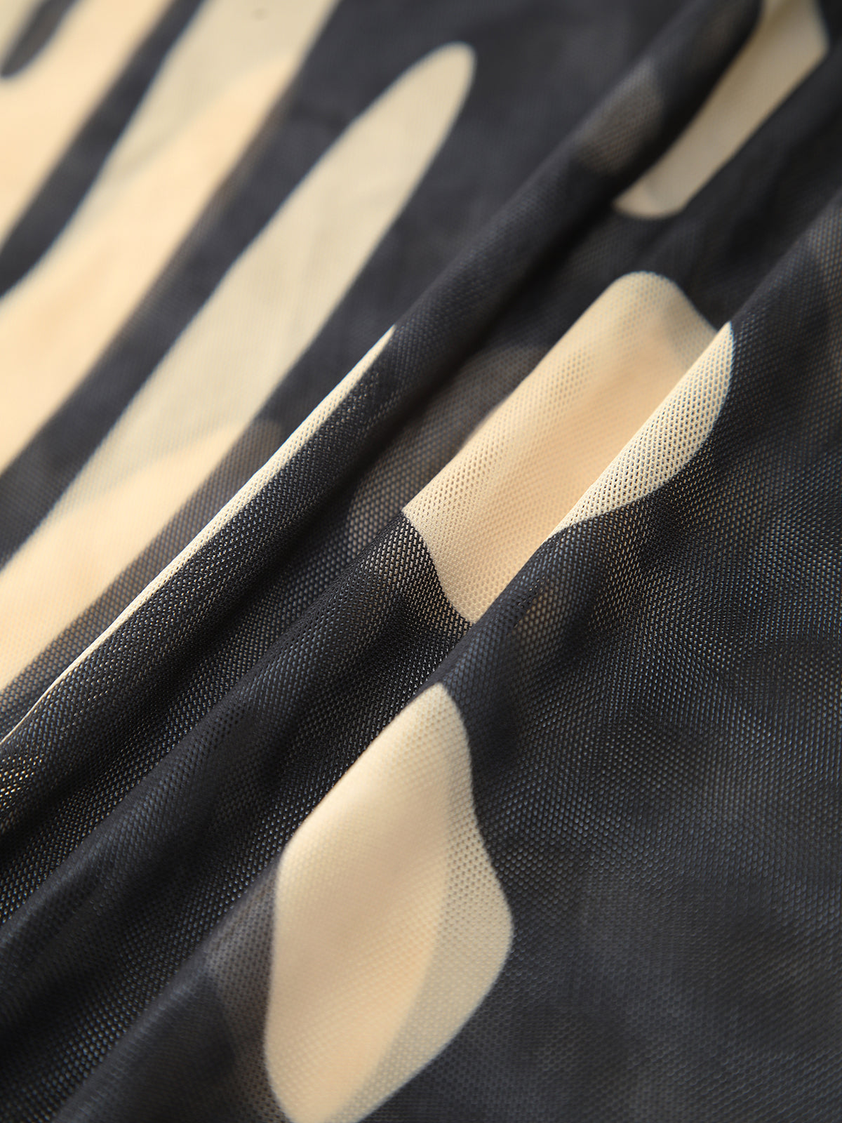 Jupe longue cache-cou en résille à imprimé oiseaux