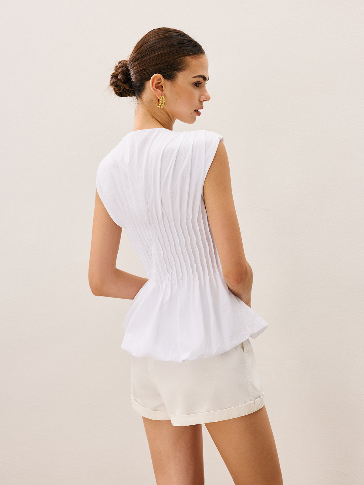 Gefaltete Peplum-Bluse mit V-Ausschnitt