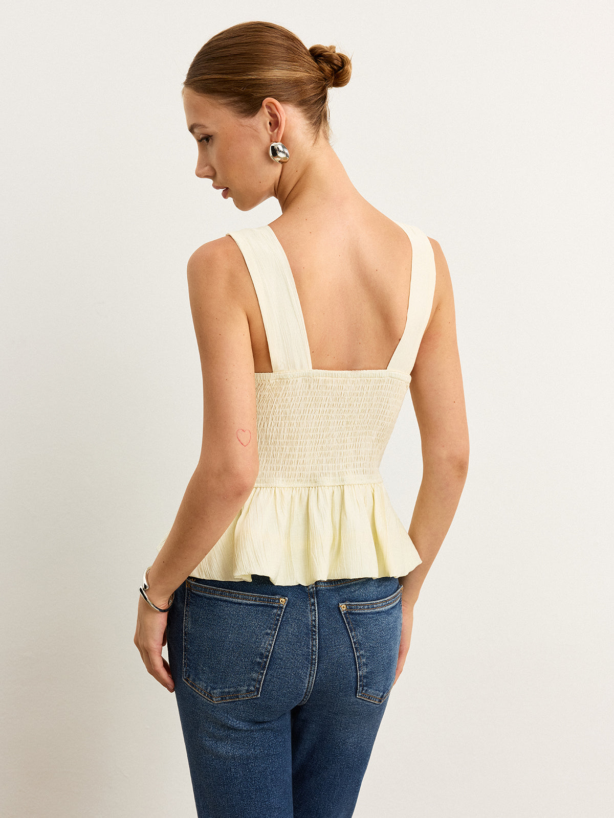 Bow-Detail Ruched Top with Peplum Hem