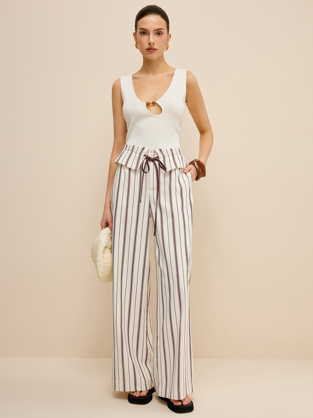 Pantalon large rayé avec taille à basque