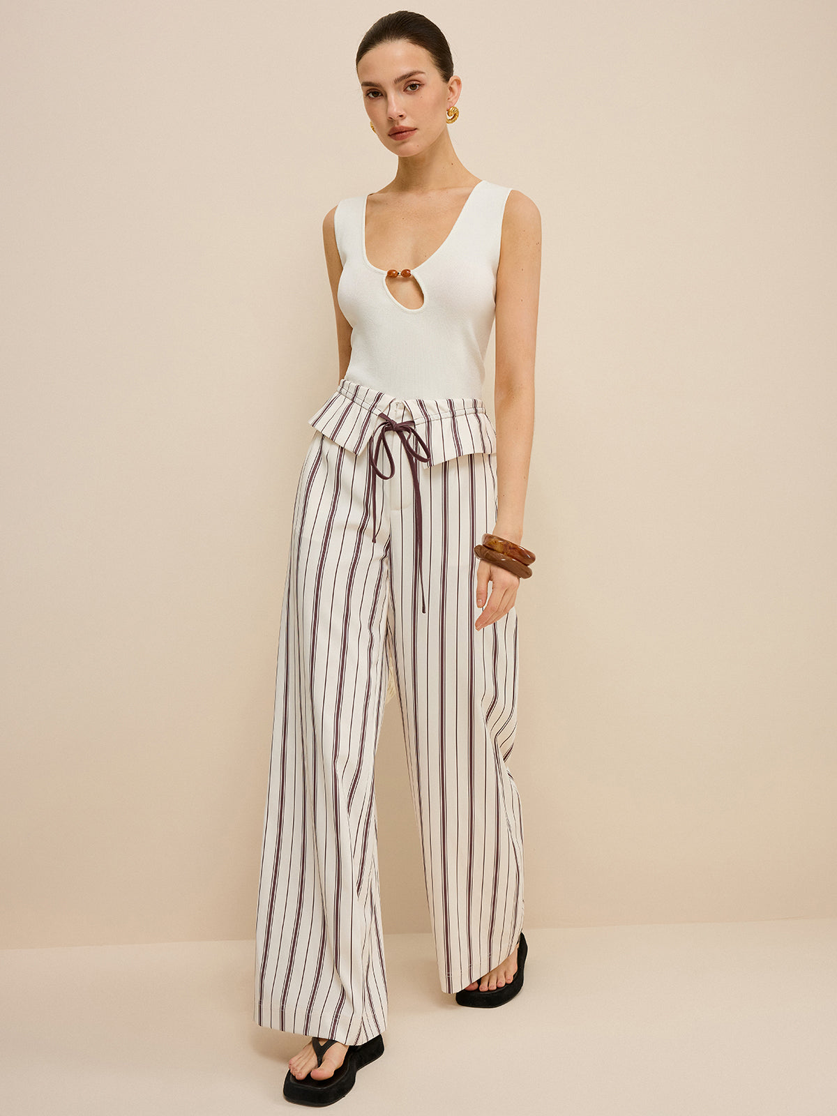 Pantalon large rayé avec taille à basque