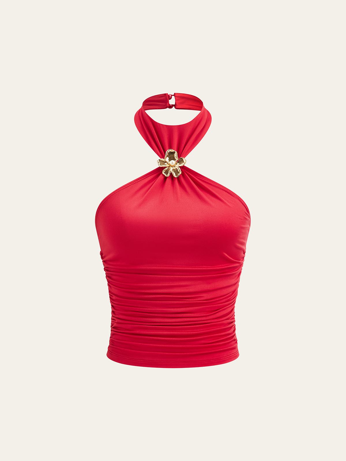 Haut semi-transparent à col halter froncé avec ornement floral en métal