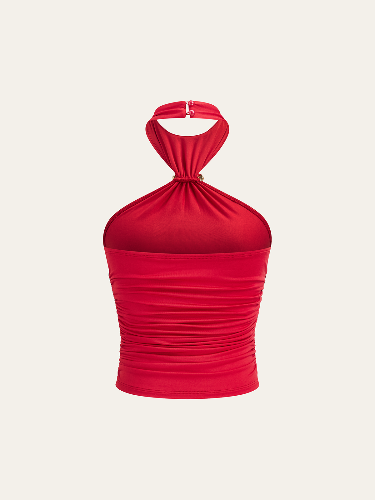 Haut semi-transparent à col halter froncé avec ornement floral en métal