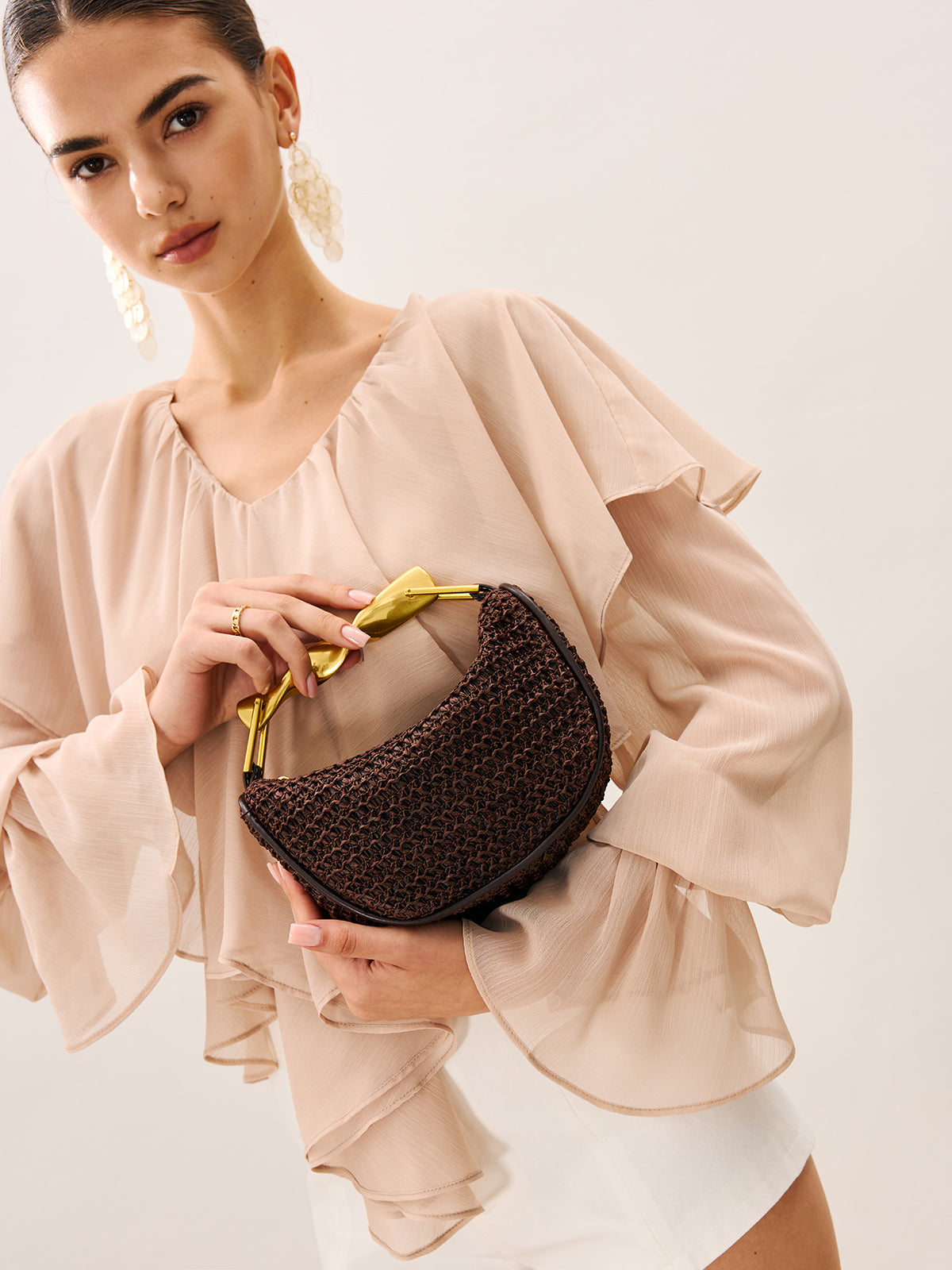 Woven Handbag With Twisted Gold Handle