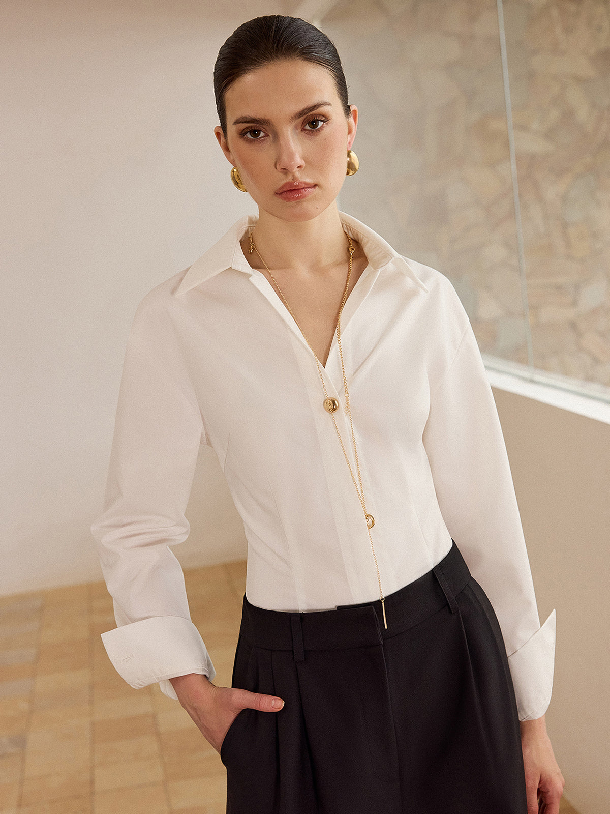Chemise à manches longues et boutons métalliques