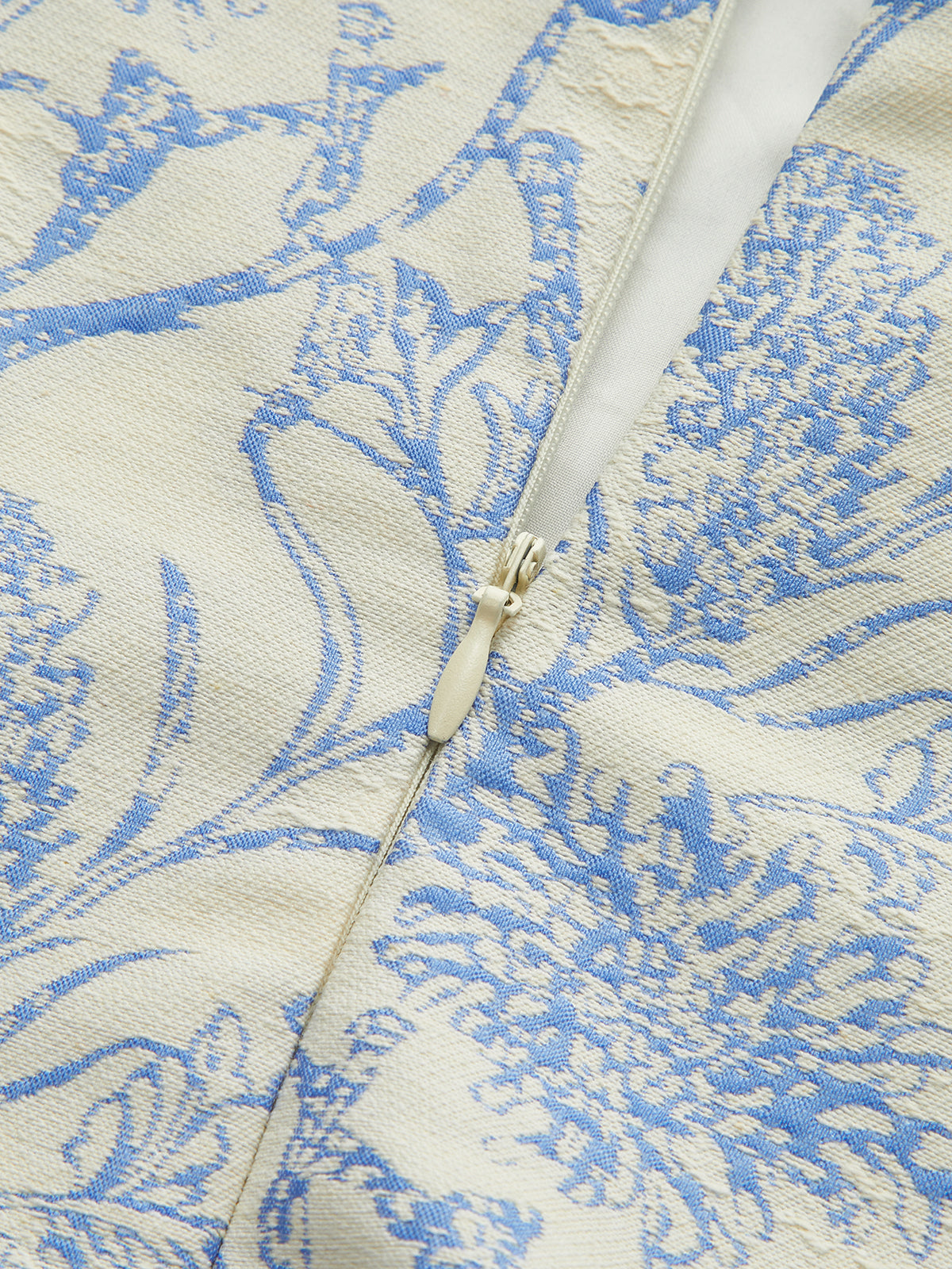 Robe sans manches à imprimé floral et ourlet plissé