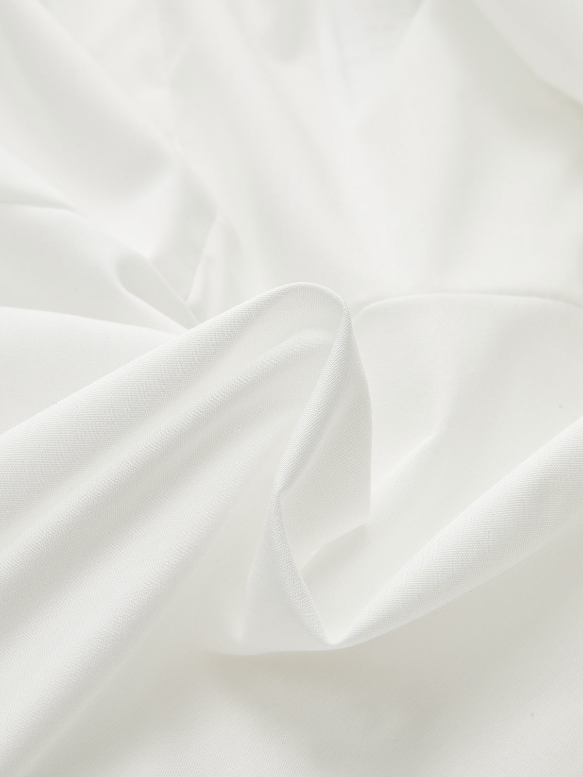 Chemise asymétrique cache-cœur avec boucle métallique