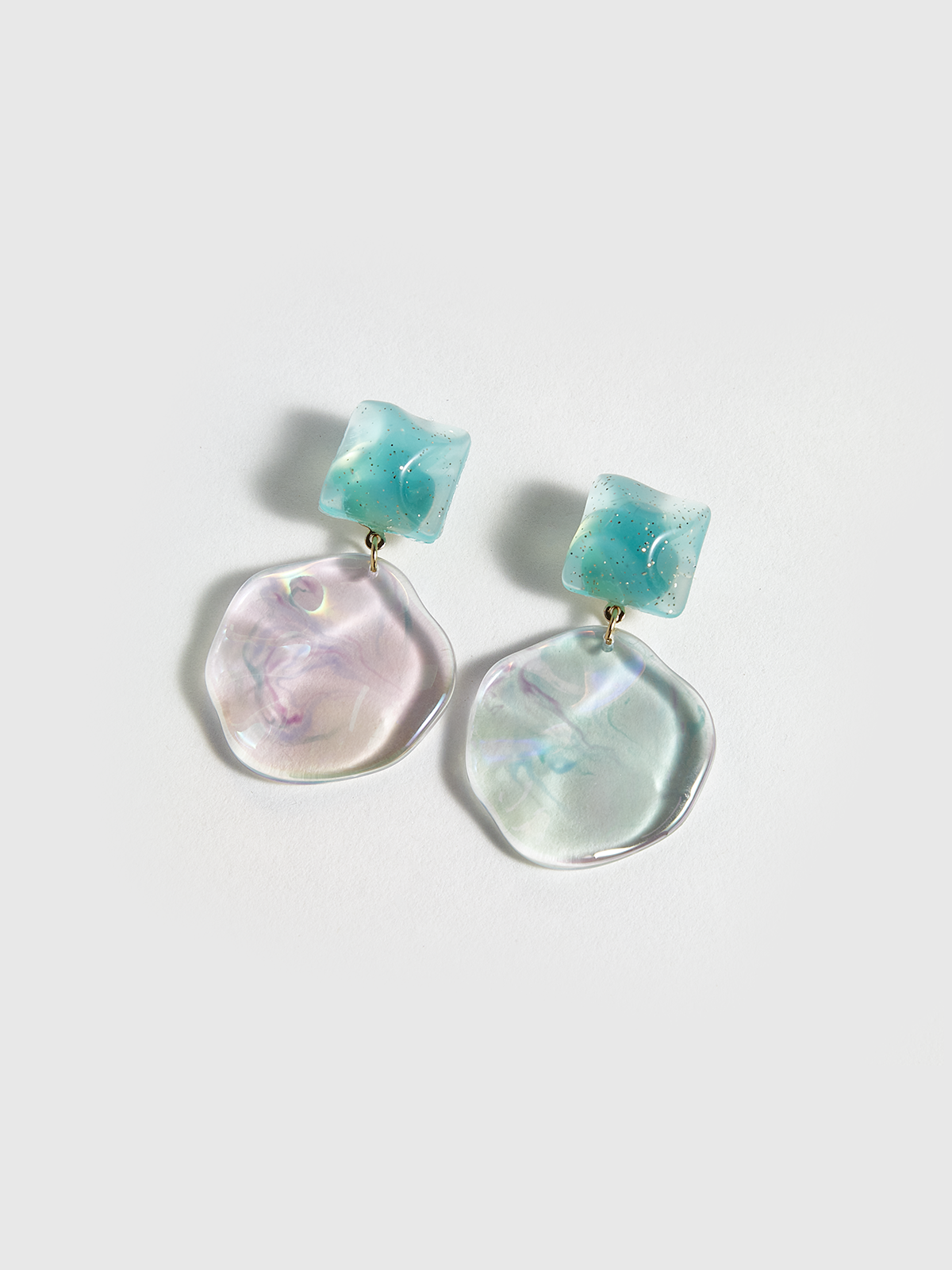 Boucles d'oreilles disque géométrique ondulé transparentes