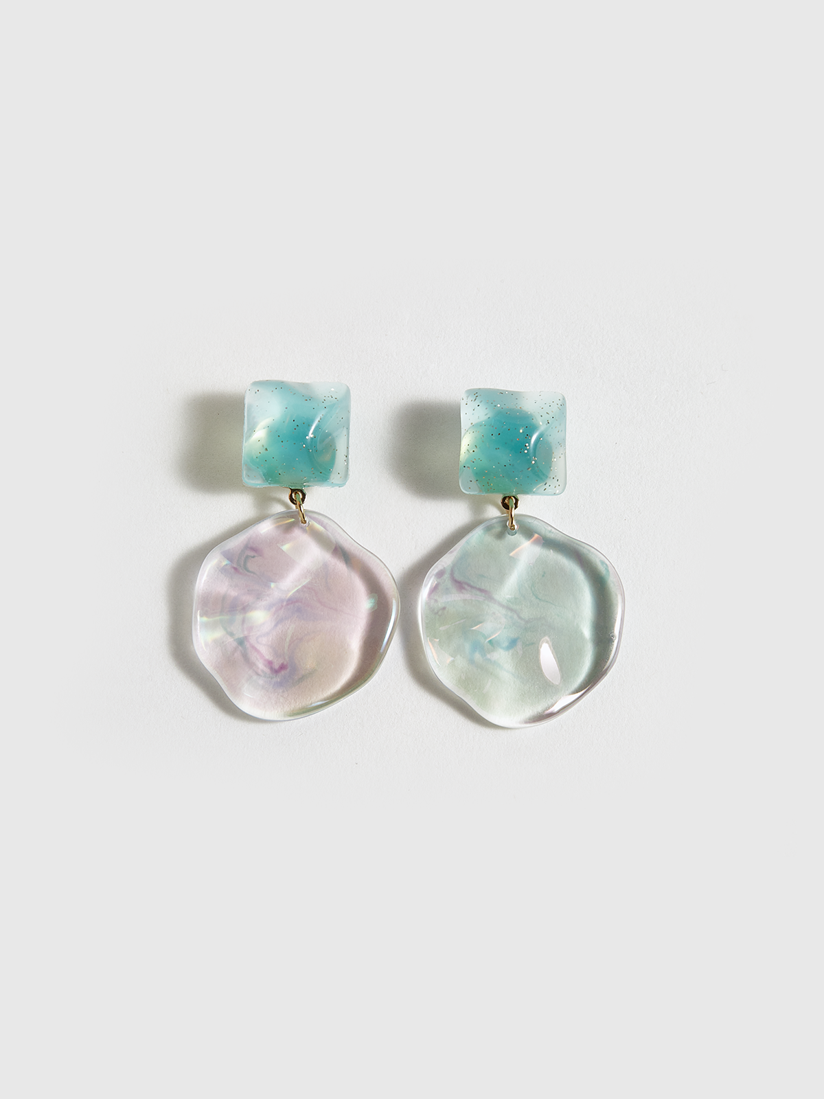 Boucles d'oreilles disque géométrique ondulé transparentes