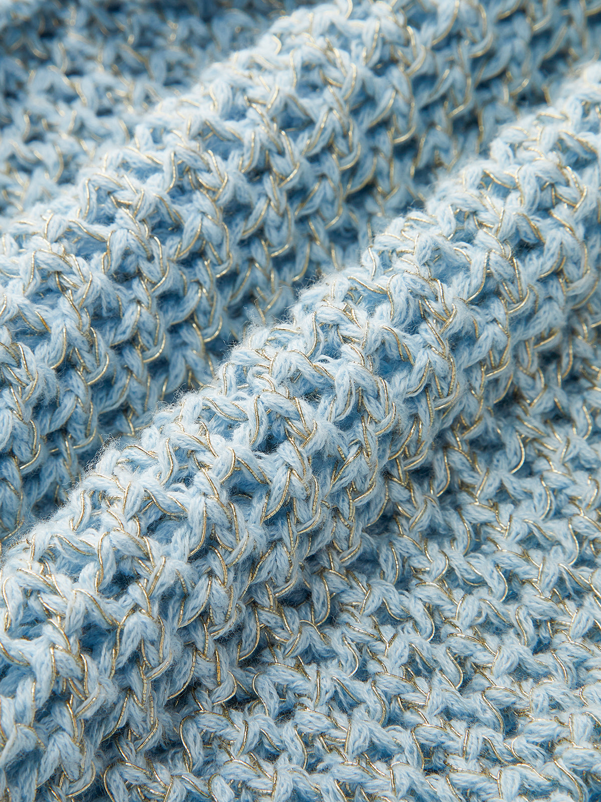 Haut en maille crochetée fleurie à une épaule