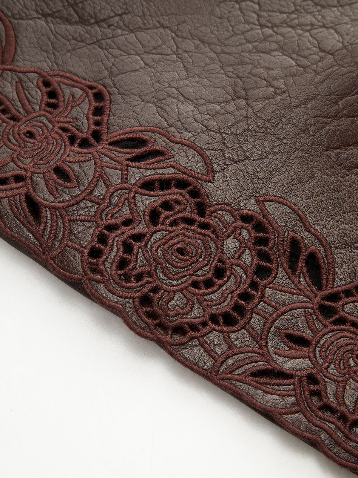 Mini-jupe en similicuir avec garniture jacquard et ceinture