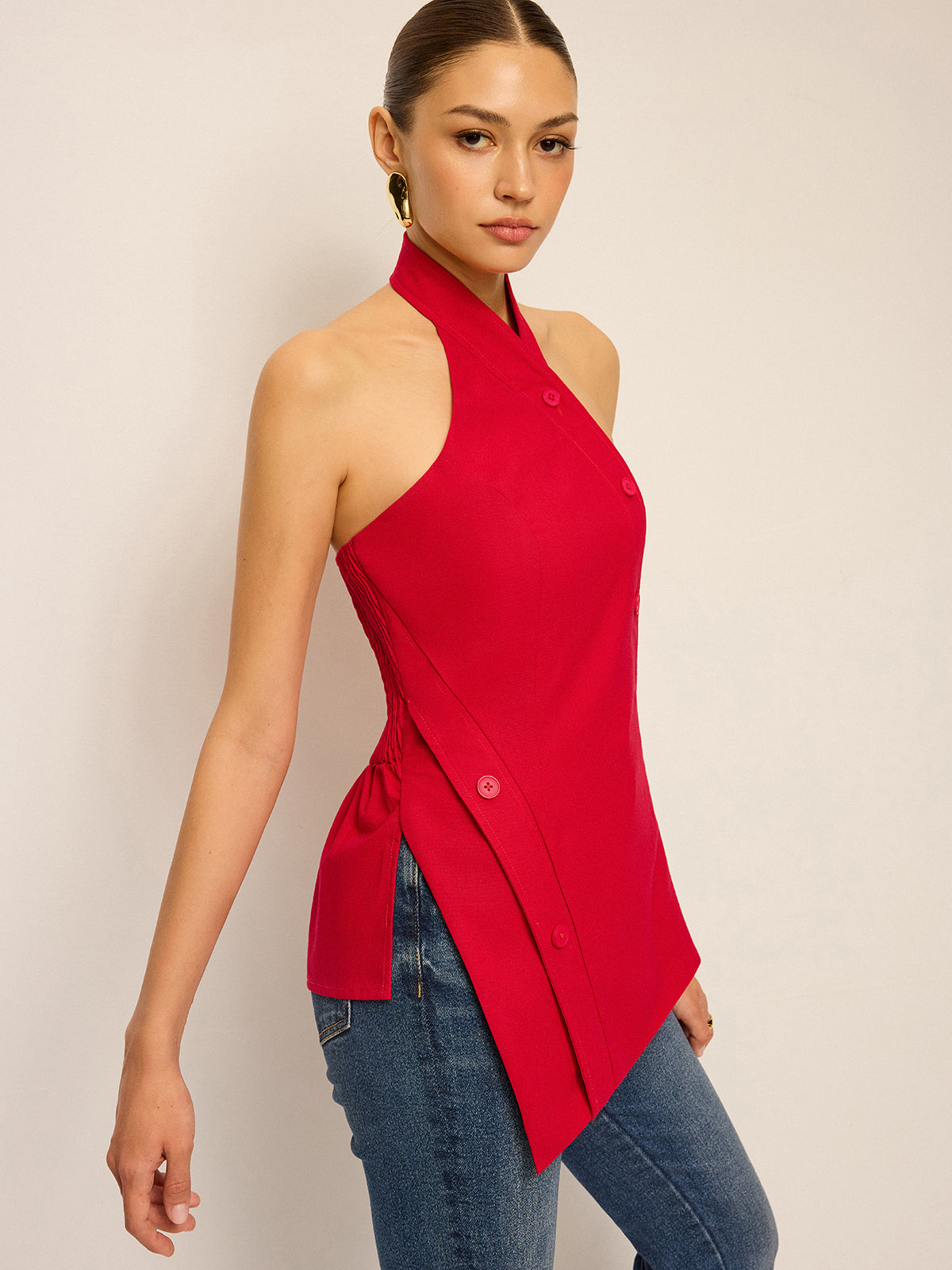 Haut asymétrique à col montant et boutons