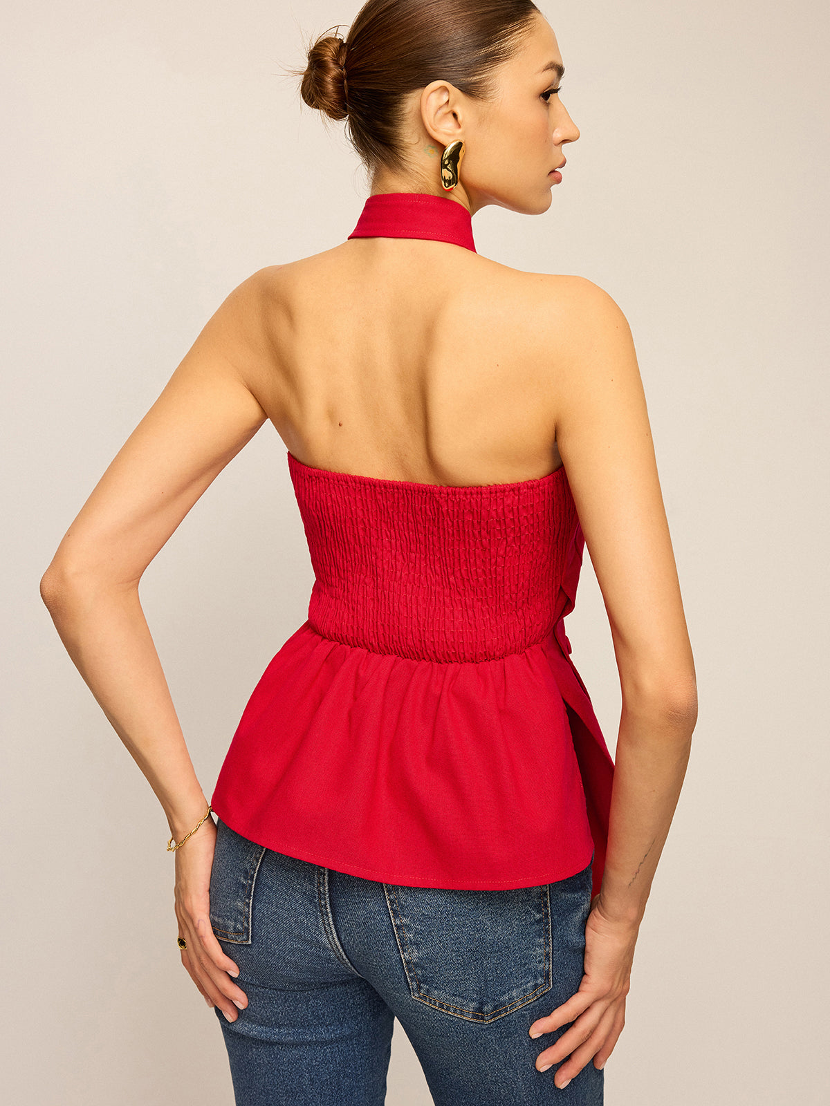 Haut asymétrique à col montant et boutons