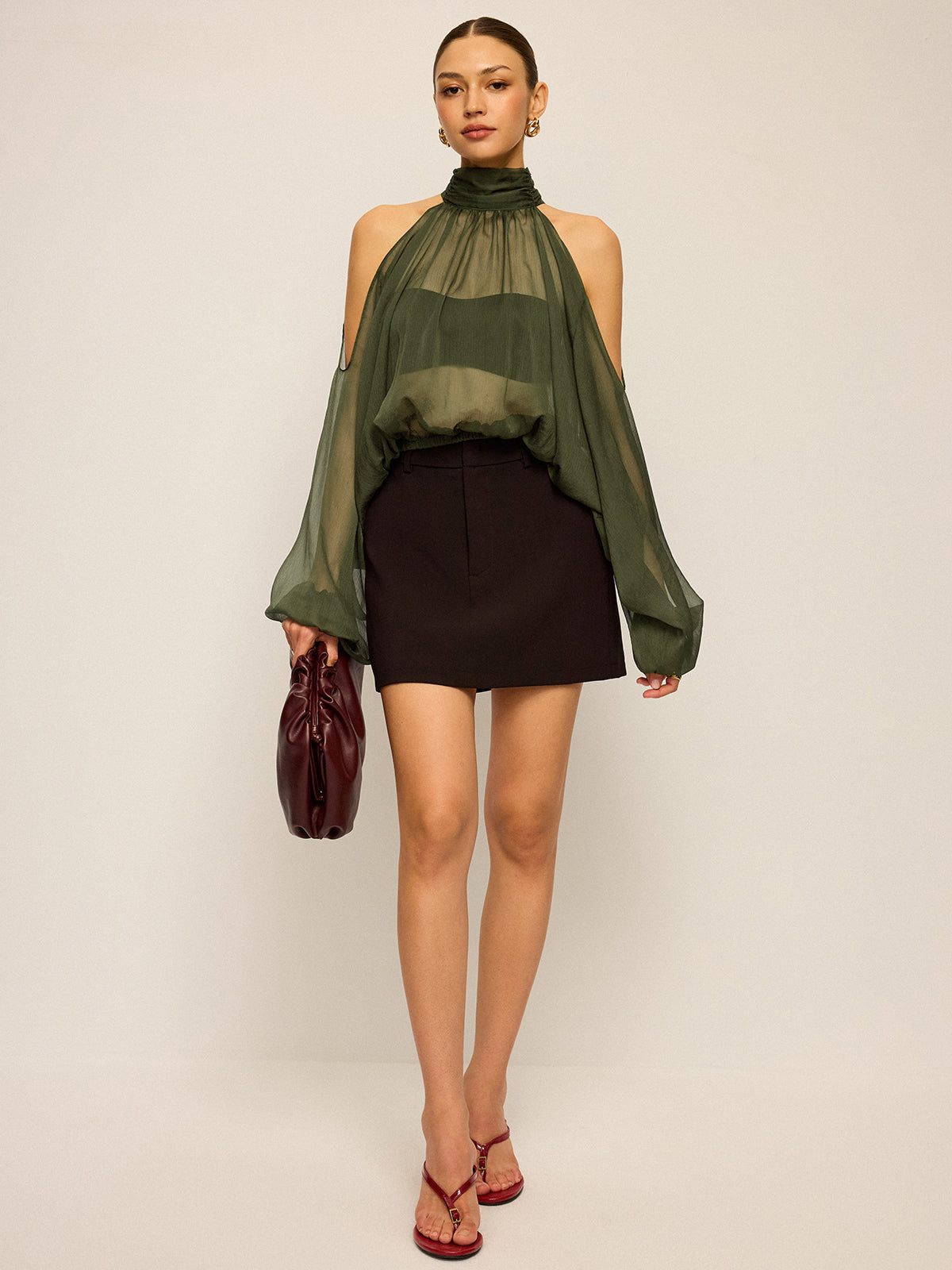 Haut transparent à col halter et manches découpées avec nœud au dos