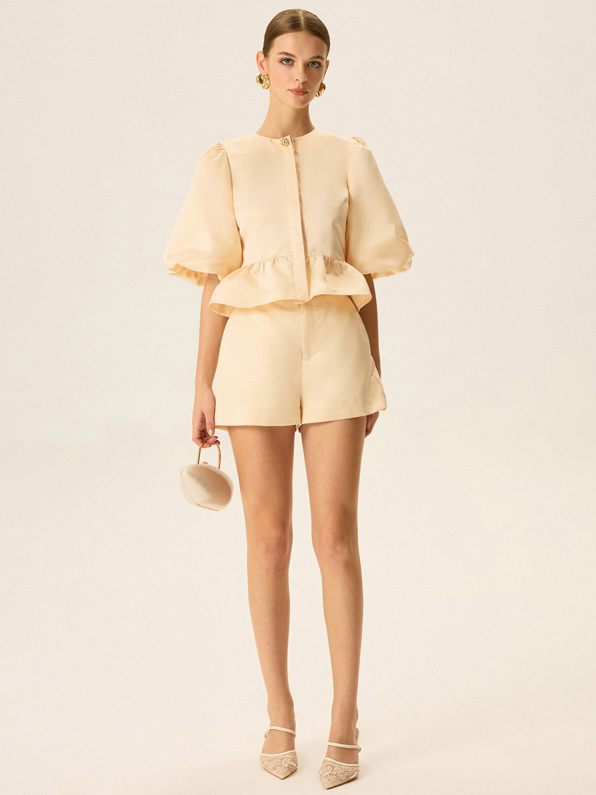 Ensemble haut péplum à manches bouffantes et short