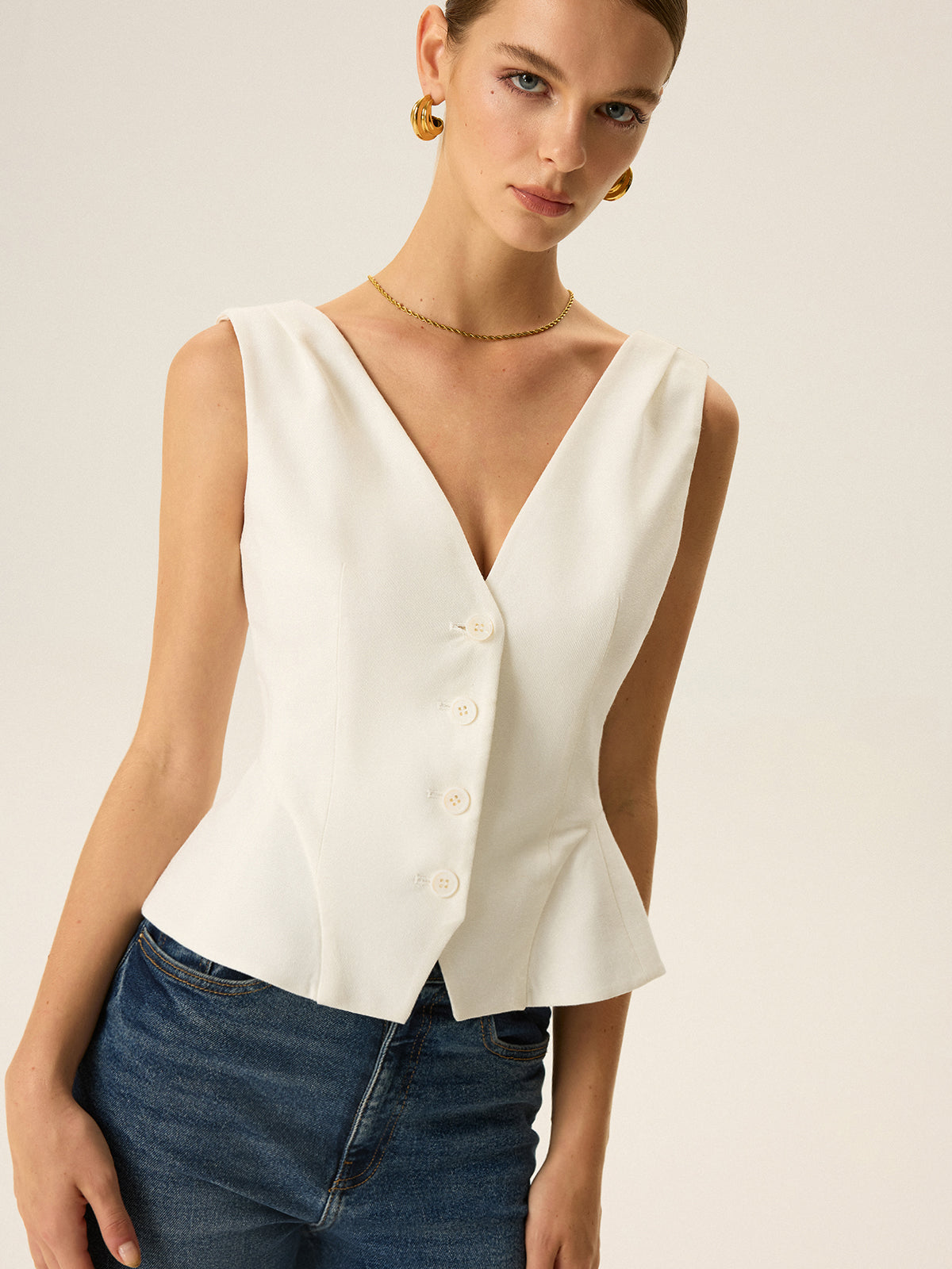 Gilet péplum boutonné sur le devant
