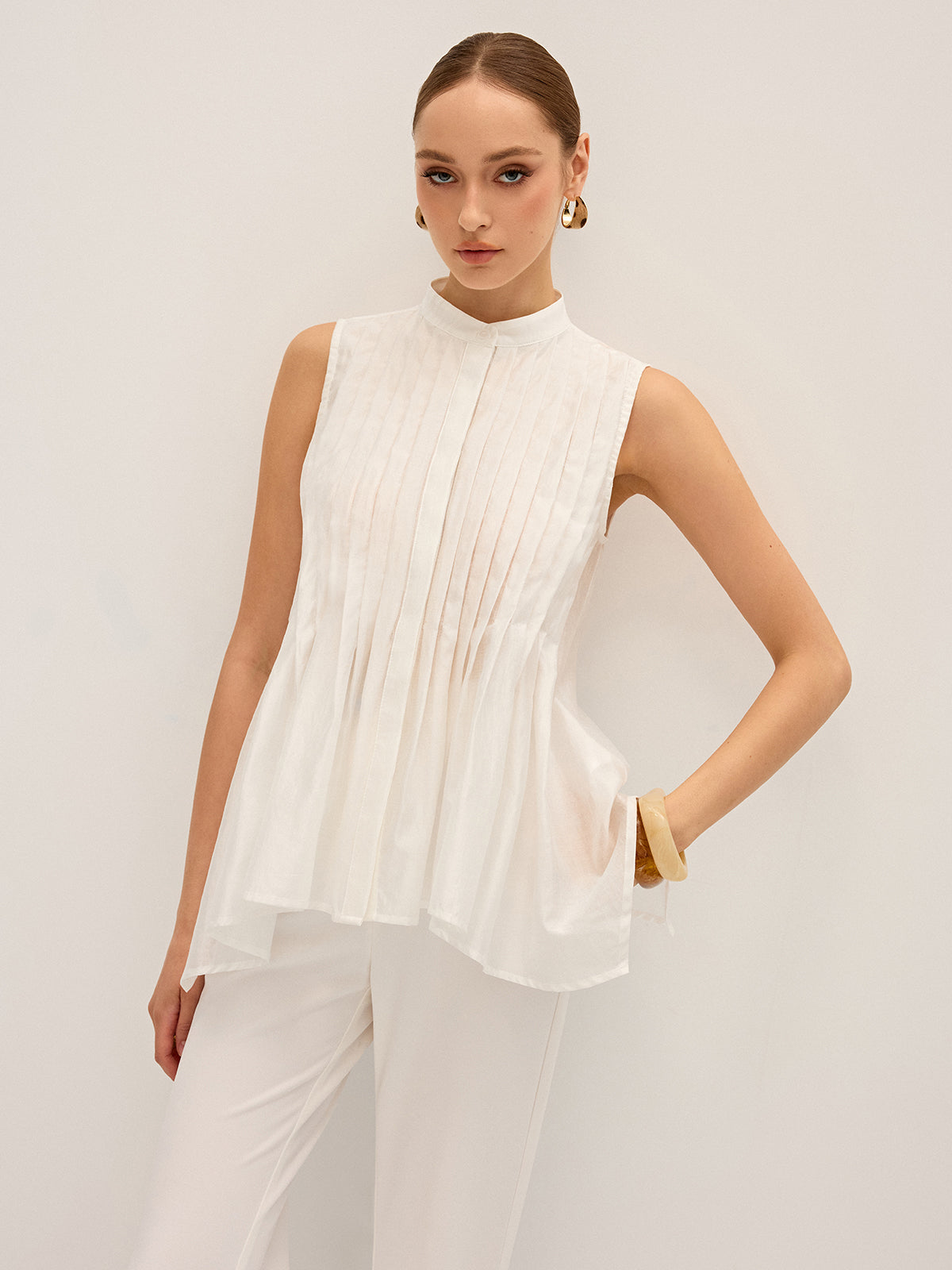 Semi-Sheer Pleated Mock Neck Blouse