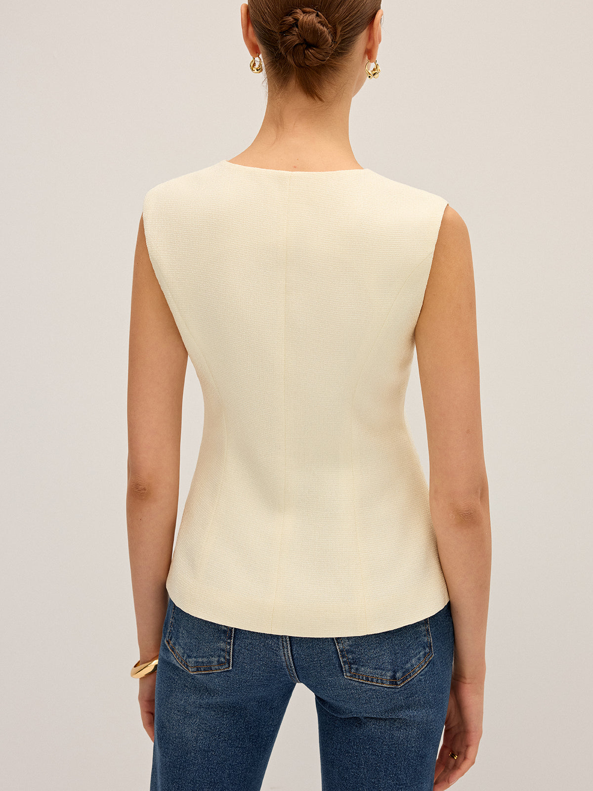 Gilet sans manches à détails métalliques