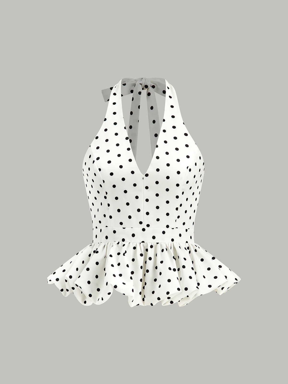 Gepunktetes Neckholder-Peplum-Top